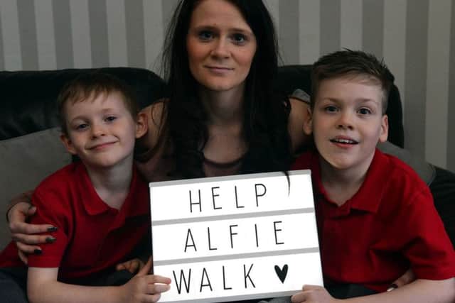 Alfie, right, with his brother Alex and mum Annie Stalley.