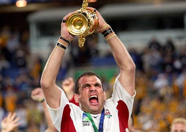 England captain Martin Johnson lifting the Webb Ellis trophy aloft after beating Australia in the Rugby World Cup Final at the Telstra Stadium, Sydney, Australia. PRESS ASSOCIATION Photo.