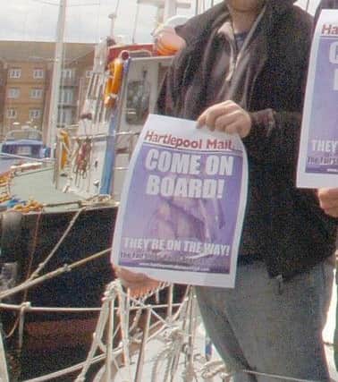 Black Diamond skipper Calvin Whitehand with a Come On Board poster.