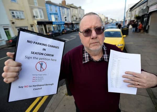 Steve Gooderham with his parking petition in Seaton Carew. Picture by FRANK REID