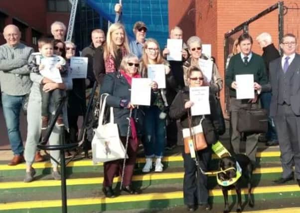 Seaton residents and supporters of the petition against parking charges, on the steps of Hartlepool Civic Centre.