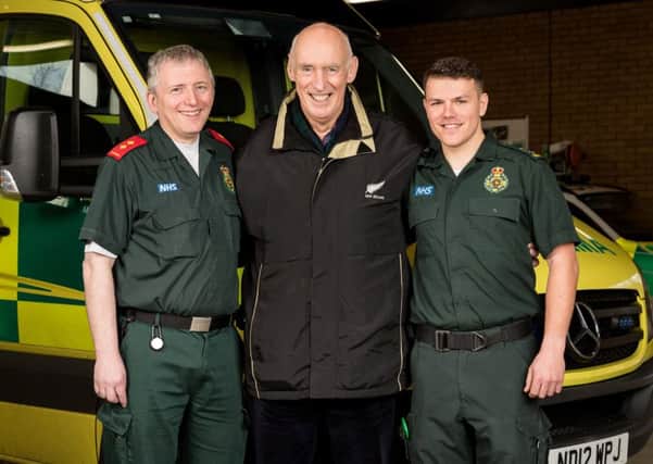 John Moore with North East Ambulance Service staff Iain Hendy (left) and Jamie Pattison