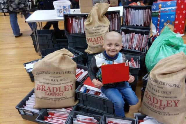 Bradley Lowery with some of the thousands of Christmas cards he received from supporters in the run up to Santa's visit.