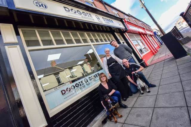 Pictured in the new Doggie Diner cafe in Middle Street, Blackhall are (l-r ) Adrienne Dickson franchise owner with Pippin and David (with Buster) Craig and Sue Nelson.