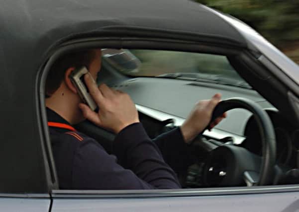 Phoning at the wheel will cost 6 penalty points