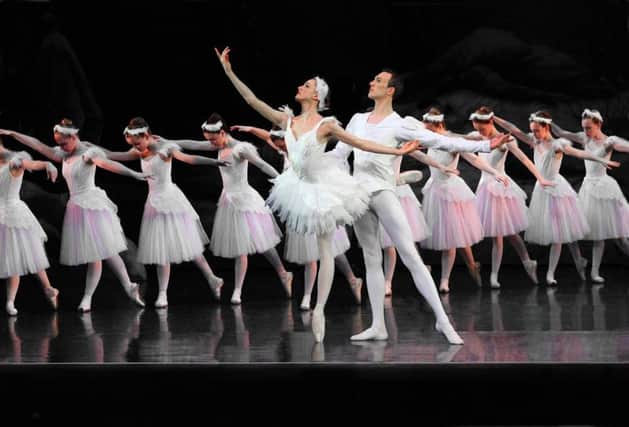 Adele Robbins, "Odette" and Oli Speers, "Prince Sergei",  with members of the Corps de Ballet, English Youth Ballet (EYB) .