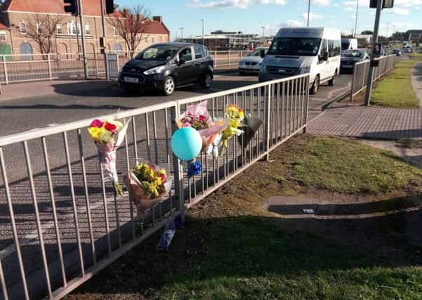 Flowers, messages and balloons left to Ethan Owens close to where he was knocked down on Marina Way.