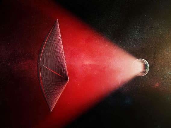 Handout from the Harvard-Smithsonian Center for Astrophysics of a light-sail powered by a radio beam (red) generated on the surface of a planet (Artist's illustration/PA)