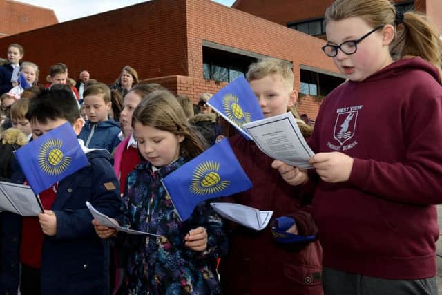 Pupils from Hartlepool primary school's sing during the Commonwealth Day celebration and flag raising outside of the Civic Centre