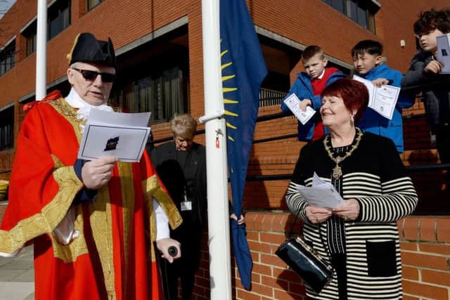 The Mayor of Hartlepool Councillor Rob Cook  making his speech during the Commonwealth Day celebration and flag raising outside of the Civic Centre as and his Mayoress and wife Brenda looks on.
