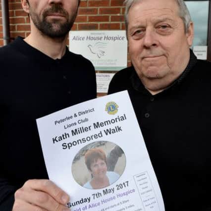 Tommy Miller (left) (son) with his dad Tommy (husband) hold a photograph of Kath . Picture by FRANK REID