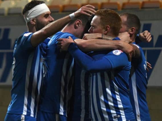 Pools celebrate Michael Woods's winner. Picture by ANDREW ROE