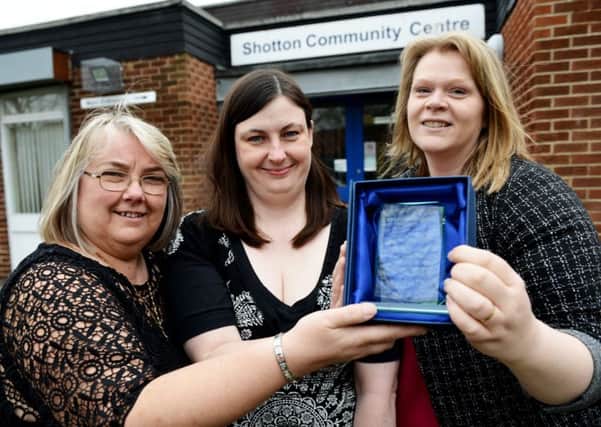 Cath Williams (centre) from England Illegal Money Lending Team presents Denise Brooks (Shotton community centre manager) (left) and Heather Wake (senior employment and support officer East Durham Homes) with their trophy .  Picture by FRANK REID