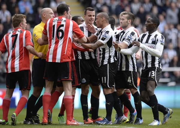 Steven Taylor at the centre of a derby confrontation.