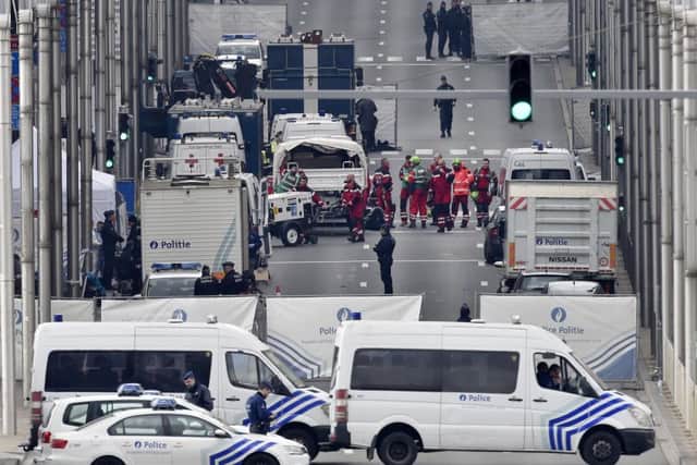 Police and rescue teams outside Maelbeek metro station in Brussels after last year's suicide bomb attack. (AP Photo/Martin Meissner)