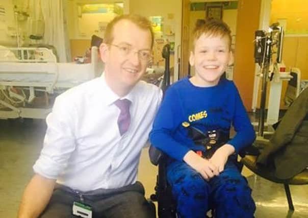 Alife Smith with his surgeon Dr Goodden.