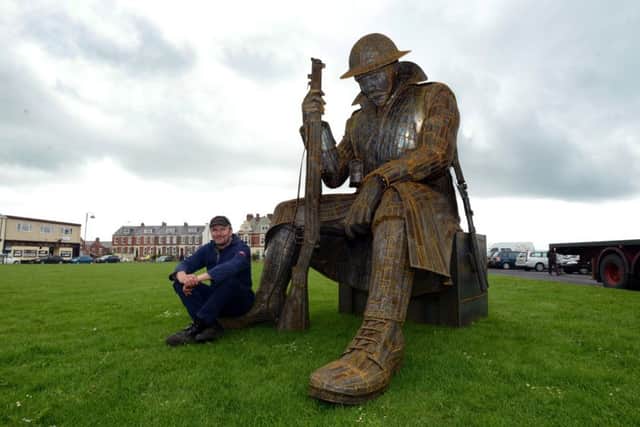 Sculptor Ray Lonsdale with his 'Tommy' statue at Seaham