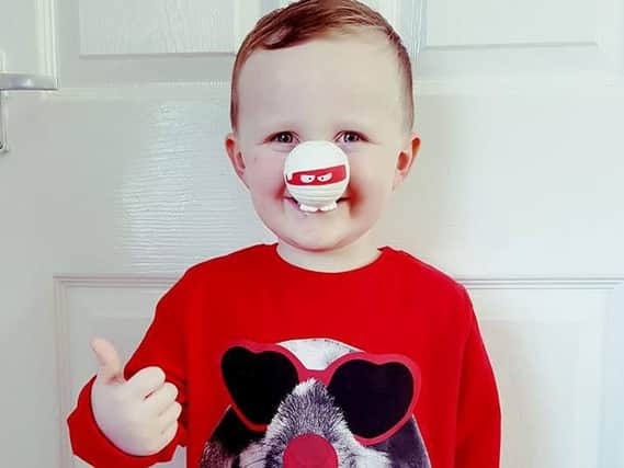 Thumbs up to Red Nose Day from three-year-old Riley Waddington.