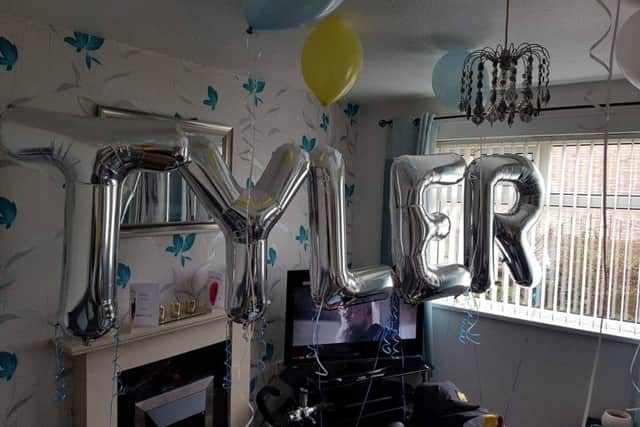 Balloons in Tyler's front room for his bike surprise