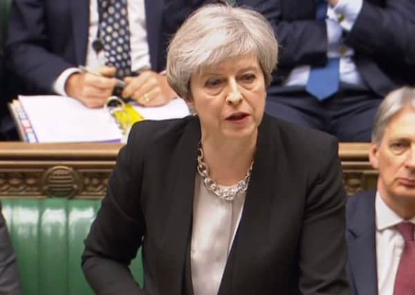 Prime Minister Theresa May speaks during Prime Minister's Questions in the House of Commons.