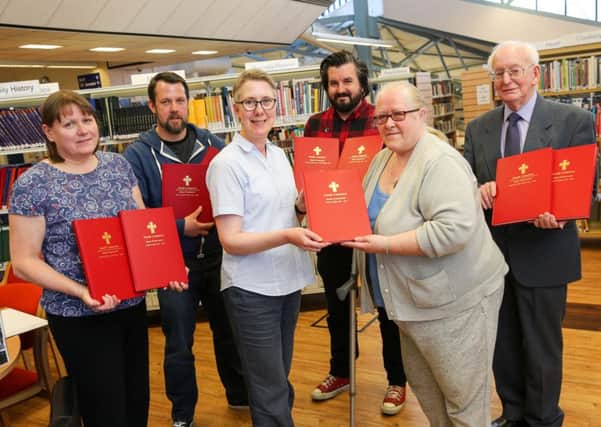 The Friends of North Cemetery hand over work they have produced to the Central Library in Hartlepool. Pictured are, from the left, Irene Cross, Gary Allen, Diane Marlborough from the library, Graeme Barker, Jane Shaw and Joseph Pullman. Picture: TOM BANKS