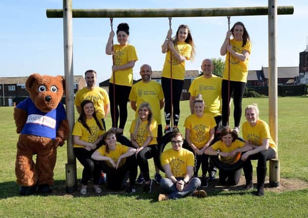 Stranton Primary School staff Rebecca See, Thomas Hardwick, Anthony Emms, Phil Pritchard, Lauren Greenan, Sian Weatherall, Neil Nottingham, Abigail Gretton, Sophie Hartshore, Andrea Windram, Chelsea Campbell, Amy Lockwood and Ellie Tyers with the mascot from Zoes Place Picture by FRANK REID