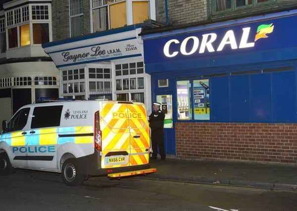 A police Officer outside of Coral Bookmaker Stranton Green, Hartlepool. Picture by FRANK REID