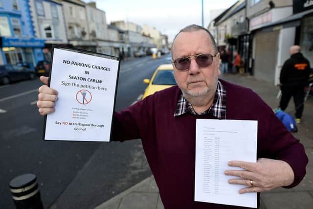 Steve Gooderham with his parking petition in Seaton Carew. Picture by FRANK REID