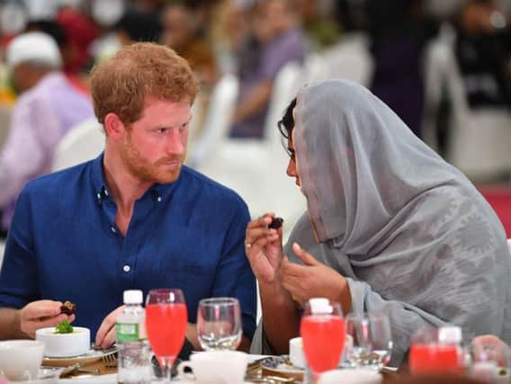 Prince Harry sits down for iftar, breaking of the fast during Ramadan at the Jamiyah Education Centre in Singapore. Picture by Tim Rooke/PA Wire
