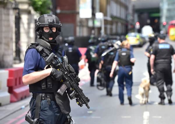 Armed police on St Thomas Street, London, near the scene of of terrorist incident at Borough Market. Photo: Dominic Lipinski/PA Wire