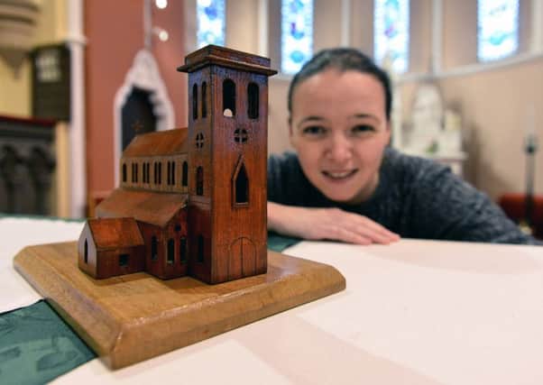 St. Mary's parish council member Bernadette Malcolmson with a wooden model of the church.  Picture by FRANK REID