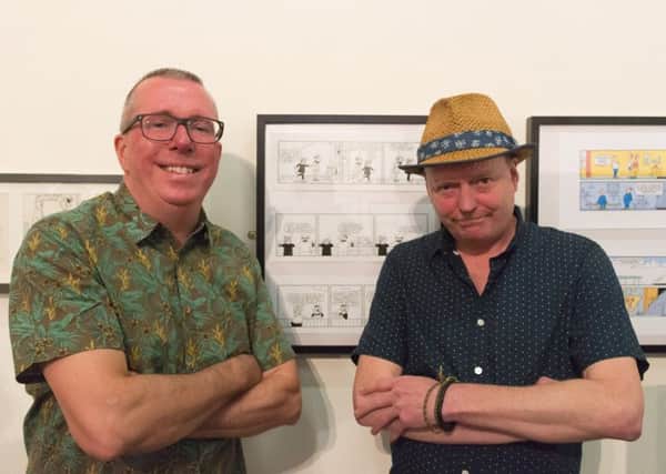 Lawrence Goldsmith and Sean Garnett with Andy Capp artwork.