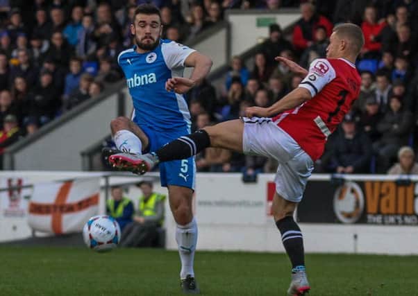 Luke George battling for possession for Chester. Picture courtesy of the Chester Chronicle