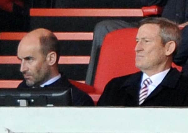 Chief executive Martin Bain and owner Ellis Short watch Sunderland slip to relegation last season.