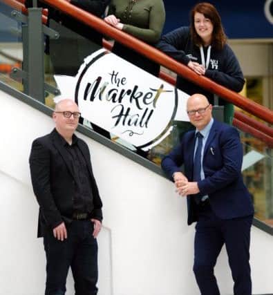 Hartlepool College of Further Education students, from left to right, Robyn Hart, Danielle O'Neill and Ashleigh Humble, with Hartlepool College of Further Education Art and Design lecturer Michael Thompson and Middleton Grange Shopping Centre manager Mark Rycraft, right.