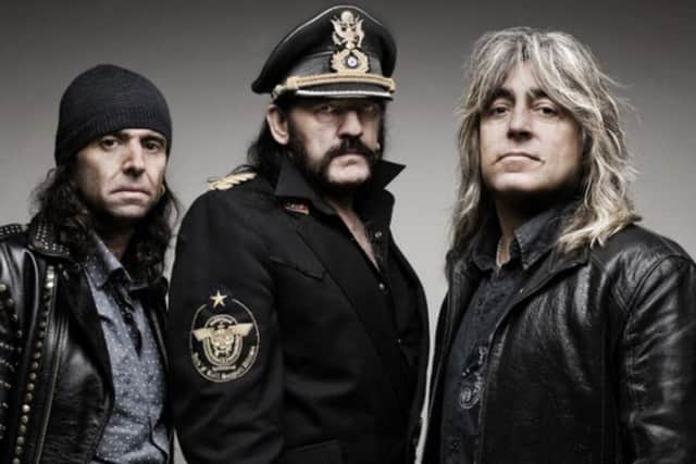 Phil Campbell (left) and Mikkey Dee (right) with late Motorhead bassist and frontman Ian 'Lemmy' Kilmister