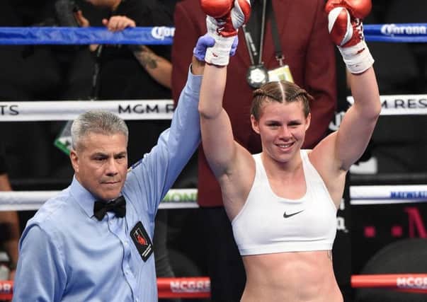 Savannah Marshall celebrates her victory over Sydney LeBlanc in the T Mobile Arena