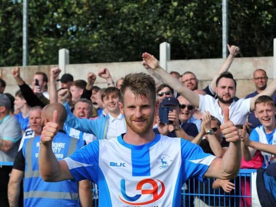 Jonathan Franks celebrates with Pools fans