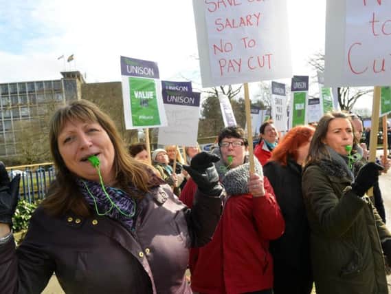 Several protests have been held outside County Hall as teaching assistants and supporters voiced concern over proposed contract changes.
