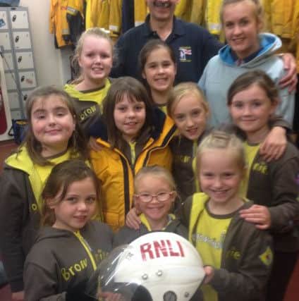 Hartlepool RNLI volunteer crew member and Lifeboat Visits Officer Steve Pounder with some of the Brownies during their visit to the lifeboat station. Picture by RNLI/Tom Collins.