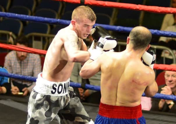 Adam Cope in action against Youssef Al Hamidi at the Borough Hall. Picture by TOM COLLINS
