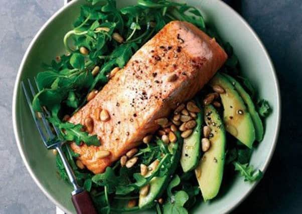 Grilled salmon with rocket, avocado and pine nut salad.