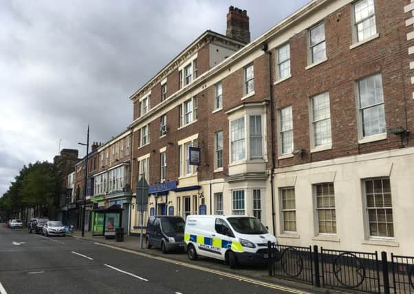 Police in Church Street after the death of a man