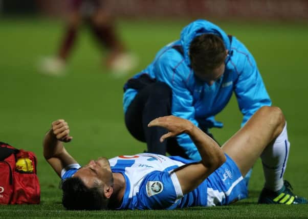 Ryan Donaldson receives treatment during Tuesday's win over Barrow. Picture by Tom Banks