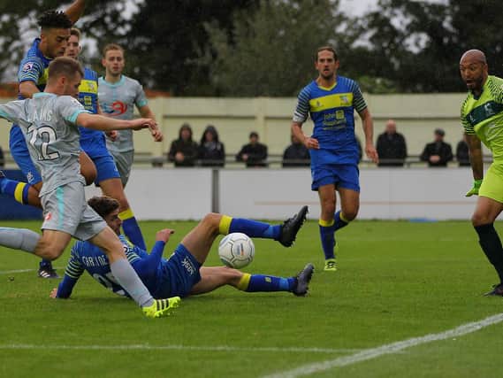 Jonathan Franks scores the last-minute winner at Solihull. Picture by GARETH WILLIAMS/ AHPIX