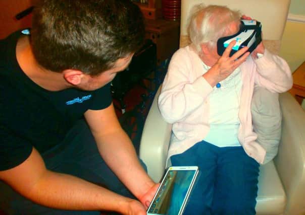 A Field View resident tries the virtual reality kit.