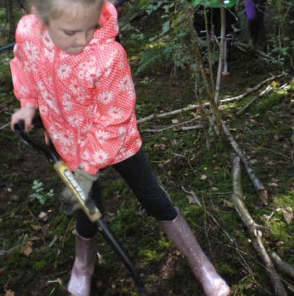 Clavering Primary School pupil Emily digs in at Wynyard Woodland park