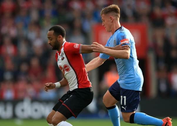 Newcastle United's Matt Ritchie (right) and Southampton's Nathan Redmond battle for the ball.