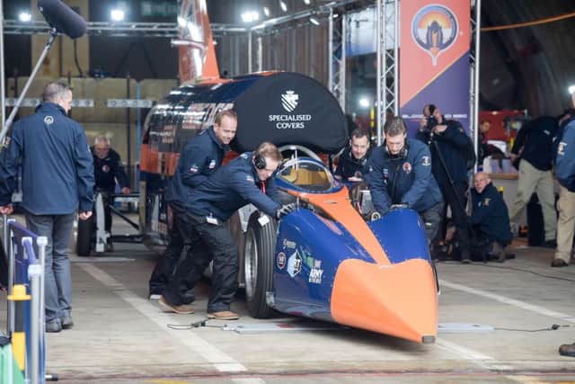 BLOODHOUND SSC is pushed out of the hangar by technicians at Newquay airport, Cornwall, where the supersonic car prepares to make its first run up to 200mph. PRESS ASSOCIATION Photo. Picture date: Thursday October 26, 2017. Photo credit should read: Ben Birchall/PA Wire