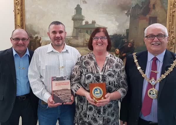 From left, Heugh Battery Museum Volunteers Garry Carden and Andrew Abson and Museum Manager Diane Stephens with Councillor Paul Beck after the presentation.